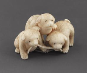 Netsuke modeled as three puppies