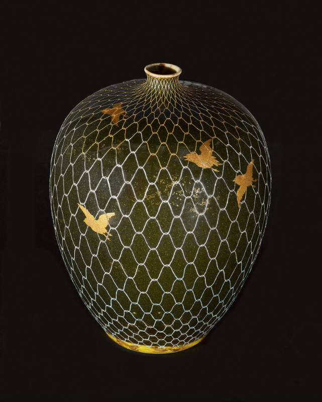 Vase decorated with flying birds in a net