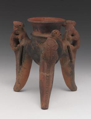 Tripod vessel with squirrel monkeys on legs