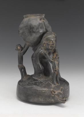 Vessel:  kneeling figure with three supporting figures