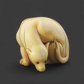 Netsuke modeled as a reclining dog