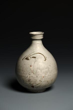 Bottle with orchid decoration