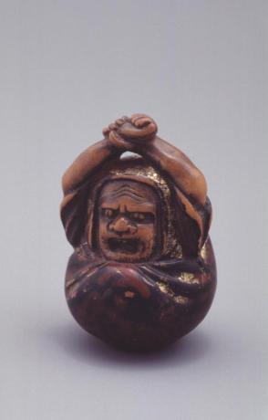 Netsuke of Daruma awakening