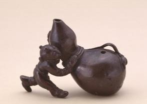 Waterdropper modelled as a herdsboy pushing a gourd