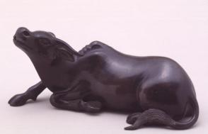 Waterdropper modelled as a reclining bull