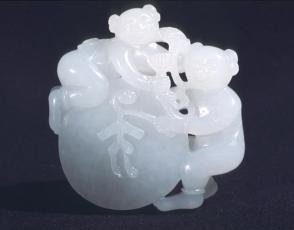 Pendant: two small boys on disk drum