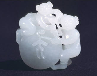Pendant: two small boys on disk drum