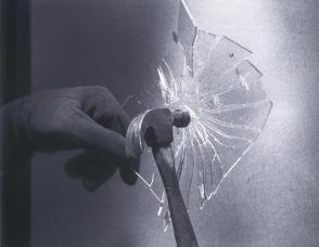 Hammer Breaks Glass Plate
