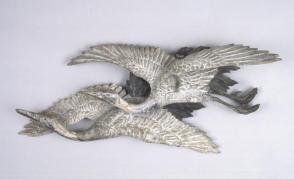 Carved wood flying cranes