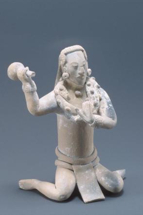Kneeling figure of a captive, performing