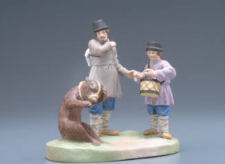 Group of man, boy with drum, and bear
