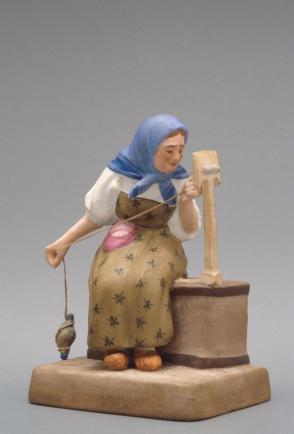 Figure of an old woman spinning