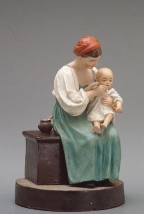 Figure of a mother feeding a baby