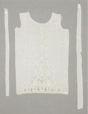 Front of a baby's christening dress