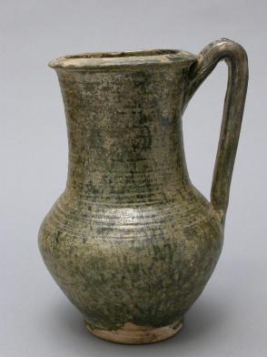 Green glazed pottery jug