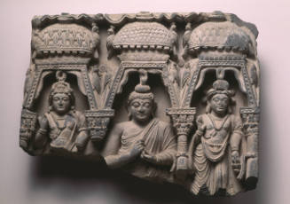 Buddha and two bodhisattvas framed by arches and stupas