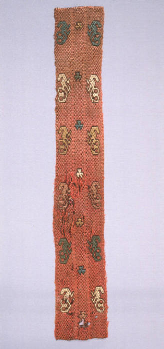 Textile fragment: stylized felines