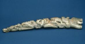 Carved ivory walrus tusk; seals and walruses