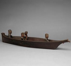 Model canoe with figures