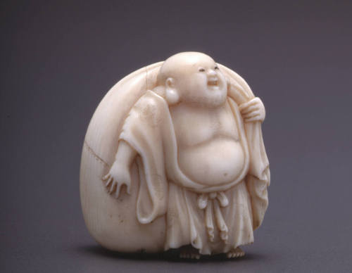 Nestuke modelled as Hotei (God of Happiness) with Treasure Bag