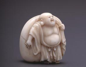 Nestuke modelled as Hotei (God of Happiness) with Treasure Bag