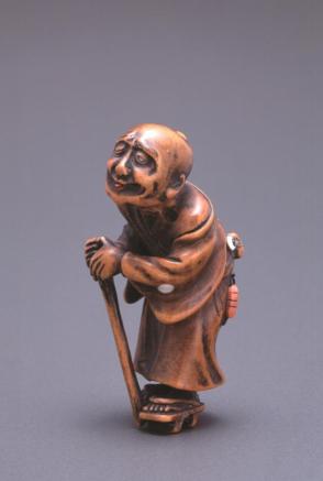 Netsuke modelled as a blind man with cane