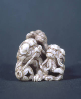 Two Shishi Playing with Carved Ball