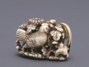 Netsuke modelled as a cock, hen and chick under peonies