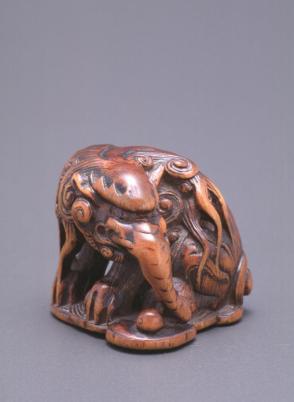 Netsuke modelled as a mythical elephant