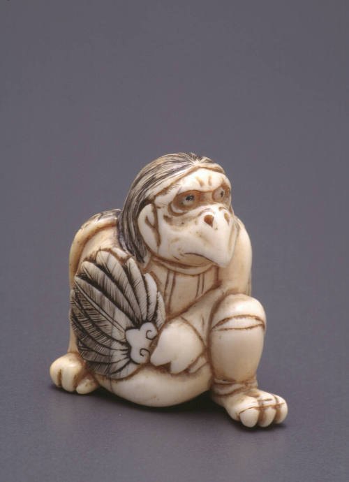 Netsuke modelled as a seated tengu