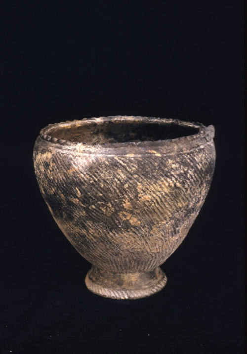 Jomon type vase with cord impressed decoration