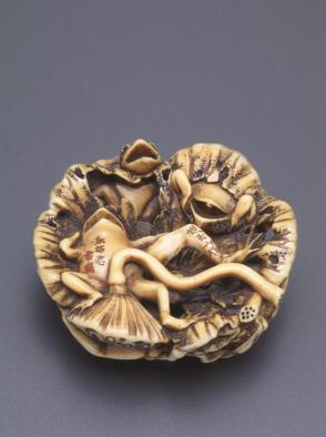 Netsuke modelled as frogs and a turtle on a lotus leaf