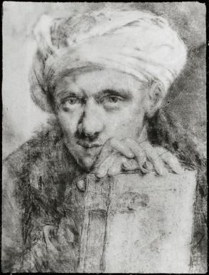 Man Wearing Turban and Holding a Book