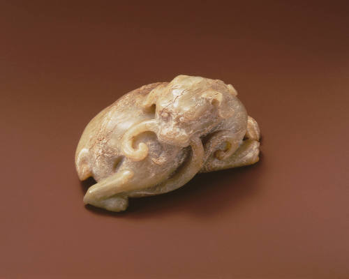 Recumbent animal figure