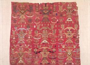 Textile fragment with figures, small boats and fish