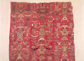 Textile fragment with figures, small boats and fish