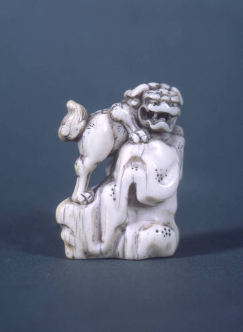 Shishi (Lion-Dog) on Rock