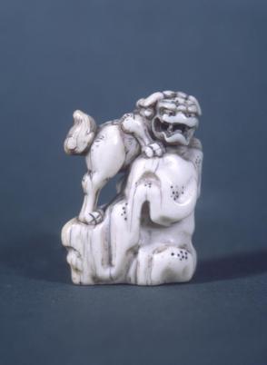 Shishi (Lion-Dog) on Rock