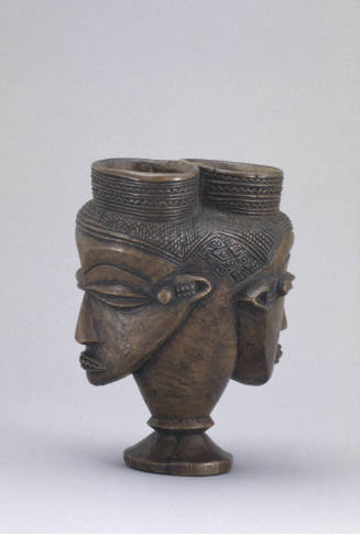 Double-headed drinking vessel