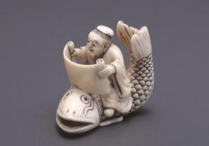 Netsuke modelled as Kinko Shonin seated on a fish