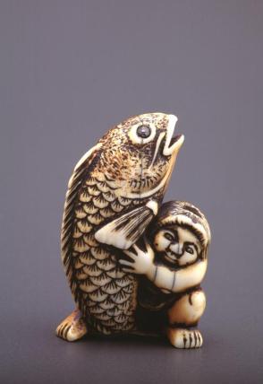 Netsuke modelled as Kintaro with a carp