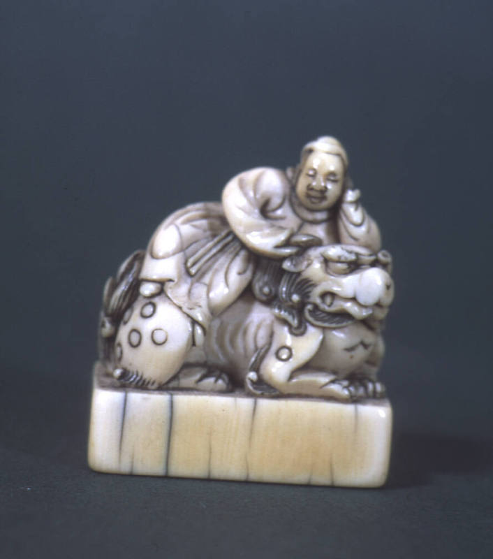 Chinese Emperor on Shishi's back asleep
