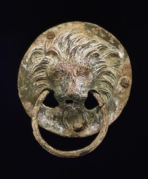 Two lion's head handles