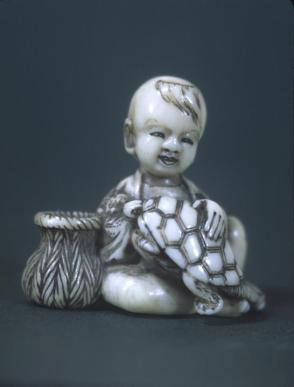 Chinese boy with tortoise and basket