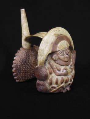 Double whistling stirrup jar-figure and fruit