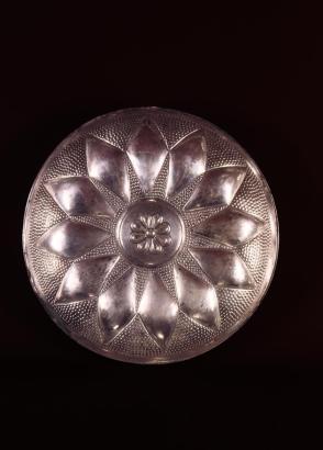 Libation bowl with radiating petal design