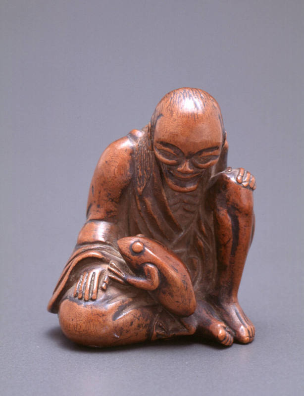 Netsuke modelled as Gama Sennin seated with a frog in his lap