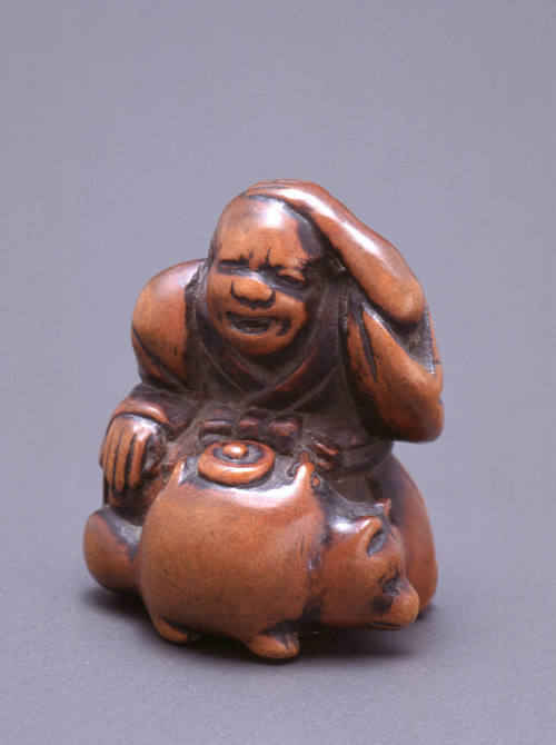 Netsuke modelled as Priest and Badger teapot (bunbuku chaga)