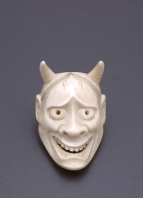 Netsuke modelled as an oni mask