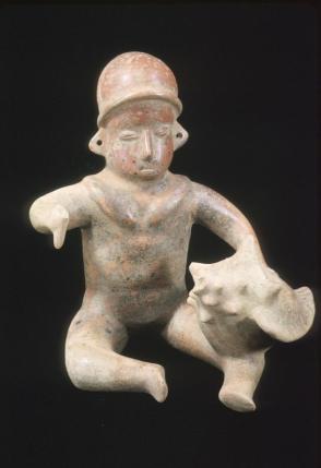 Seated figure with conch shell